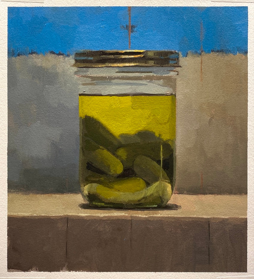 A half-full jar of little pickles