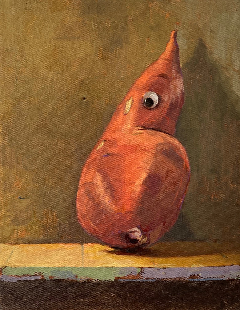 Three-quarter view of a single yam that’s been anthropomorphized by a combination of props and suggestions